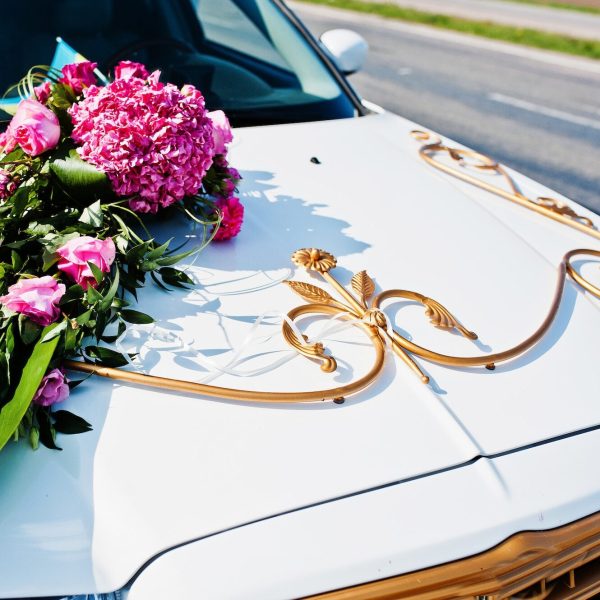 Elegance wedding limousine car with floral decoration.